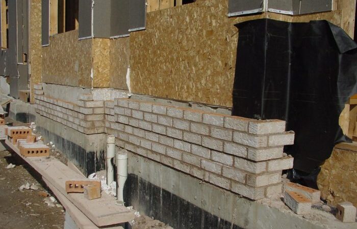 Siding over brick